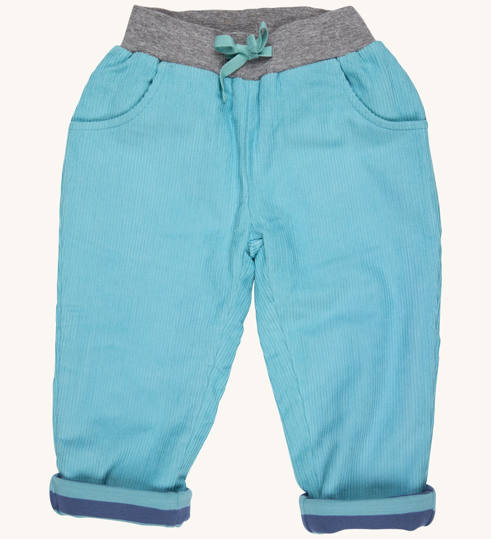 Pigeon Organics lined cord trousers - GOTS turquoise coloured organic cotton trousers in a corduroy style. Features 2 side pockets, a soft elastic waistband in grey and turquoise drawstring detail at the front.