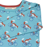 A close up of the turquoise cycling fox striped Pigeon organics long sleeve top available at Babipur showing the popper fastener detail on the shoulder