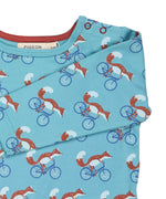 A close up of the turquoise cycling fox striped Pigeon organics long sleeve top available at Babipur showing the popper fastener detail on the shoulder