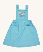 Pigeon Organics pinafore- GOTS organic cotton pinafore sleeves dress in turquoise corduroy. Features 2 small pockets at the front, button fasteners on the shoulders, an elasticated waist band and a fox riding a bike embroidery on the chest.