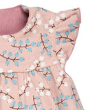 A close up of the winter berry print detail on the Pigeon organics winter berry dress showing the frill detail available at Babipur