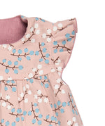A close up of the winter berry print detail on the Pigeon organics winter berry dress showing the frill detail available at Babipur
