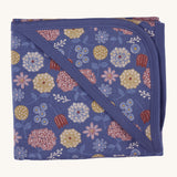 Pigeon Organics hooded blanket. A 100% GOTS organic cotton navy hooded blanket with multicoloured artistic flowers printed all over