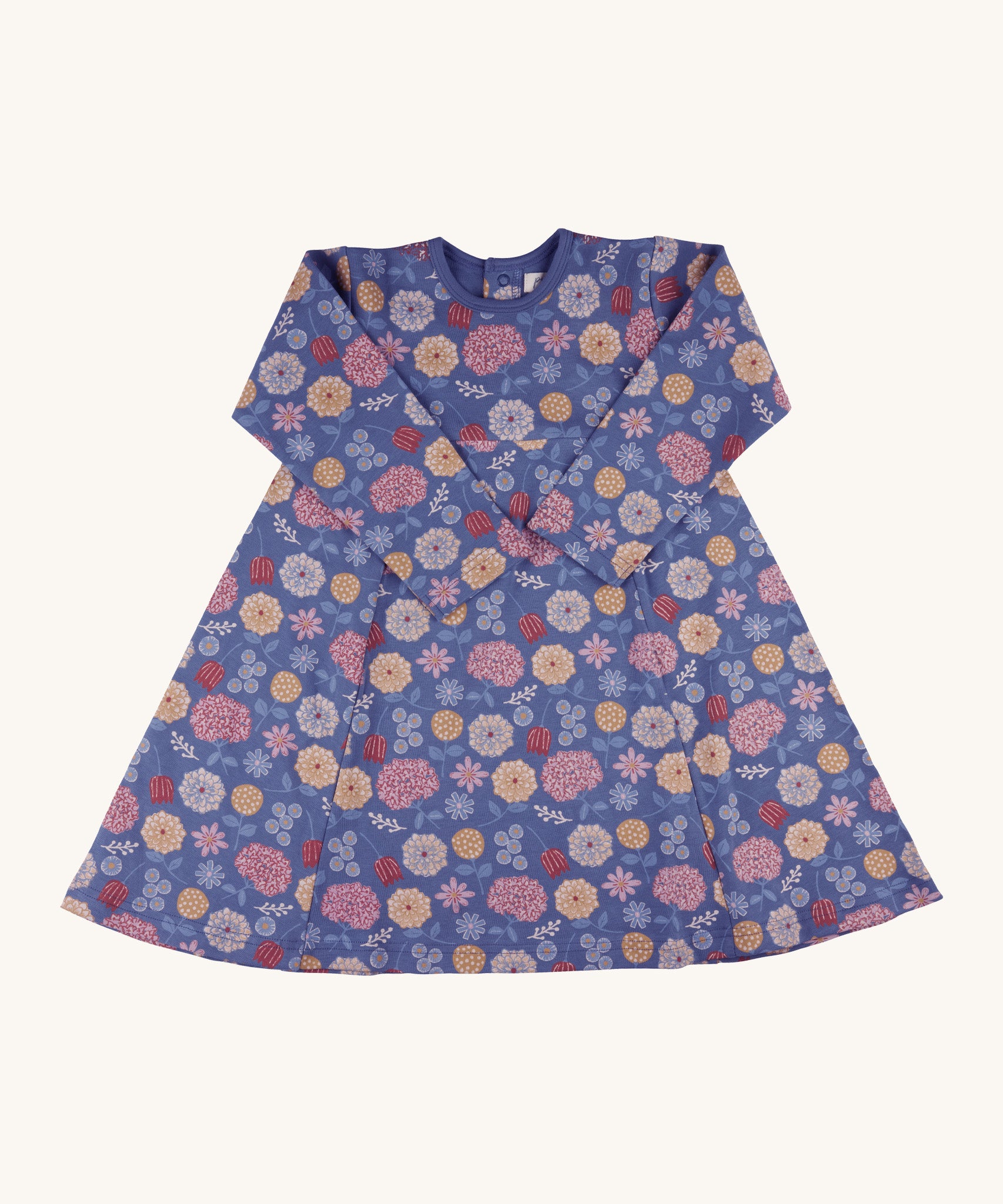 Pigeon Organics pinafore dress - GOTS organic cotton navy long sleeved dress with a popper fastener on the back for easy fitting. Features multiple prints of multicolour artistic flowers and leaves 
