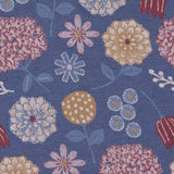 Close up of the Pigeon Organics winter bloom design showing the multiple artistic prints of flowers on light blue organic cotton fabric