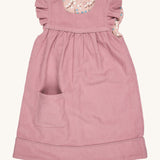 Pigeon Organics reversible Winter shift dress in pink - GOTS organic cotton sleeveless dress in a corduroy style with a reversible winter berry design. Features a small pocket on the bottom of the dress and popper fasteners for easy fitting