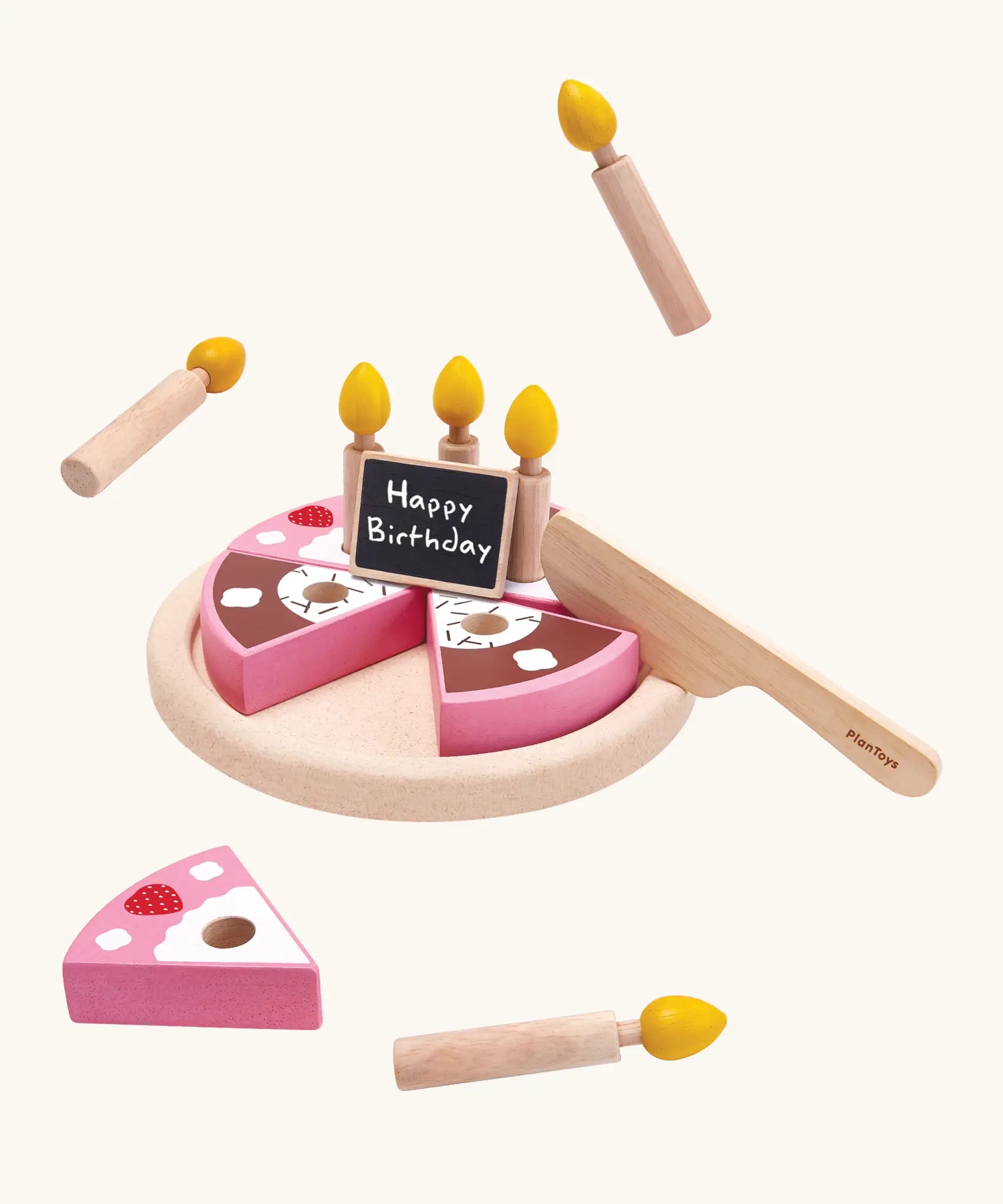 PlanToys wooden birthday cake set. Includes pink and brown slices, serving plate, candles and a chalkboard to write on