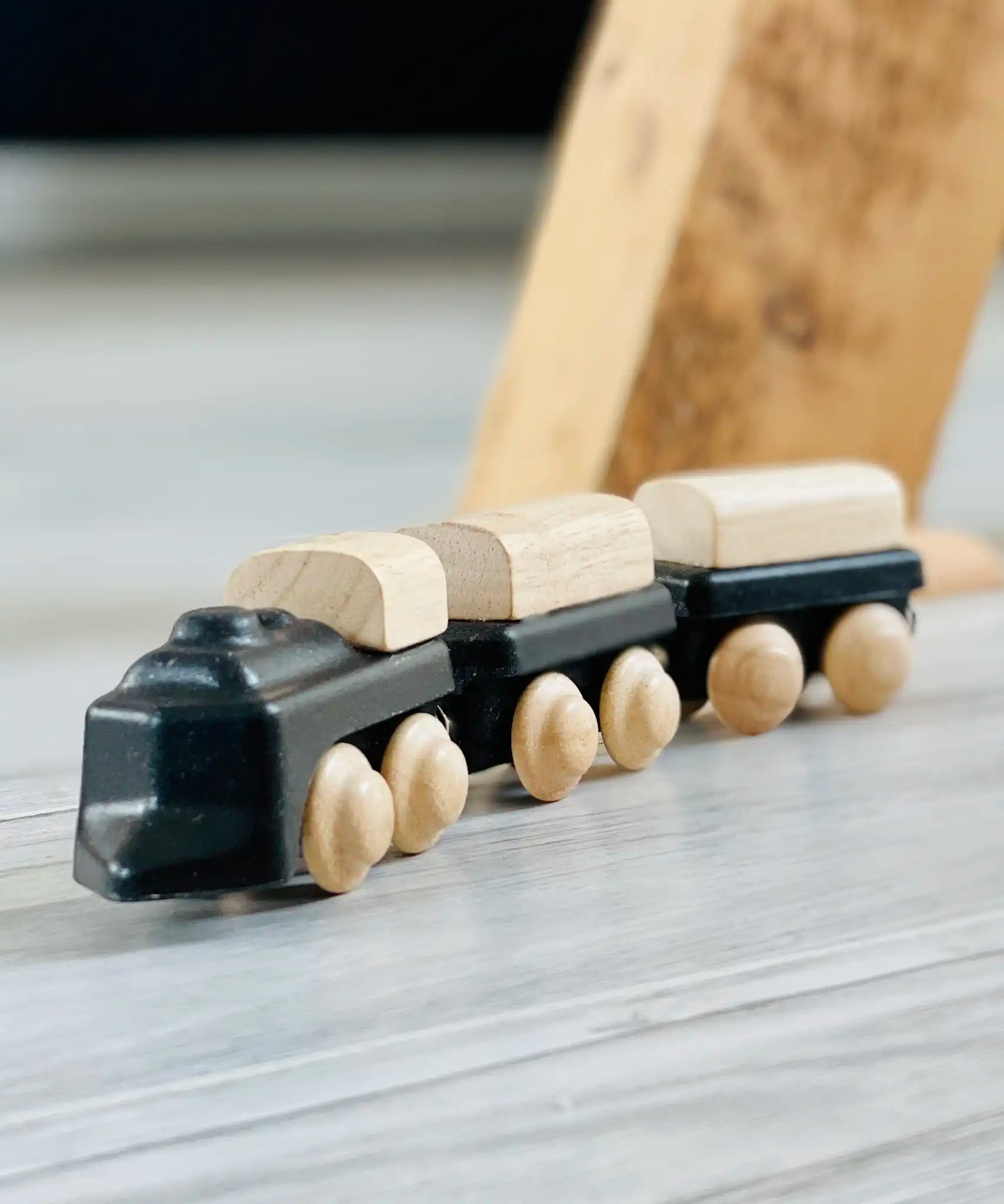 PlanToys black wooden classic toy train. Three carriages with magnetic connectors. 