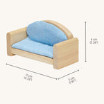 A close up of the sofa from the Plan Toys dolls house furniture set showing the dimensions and light blue cushion