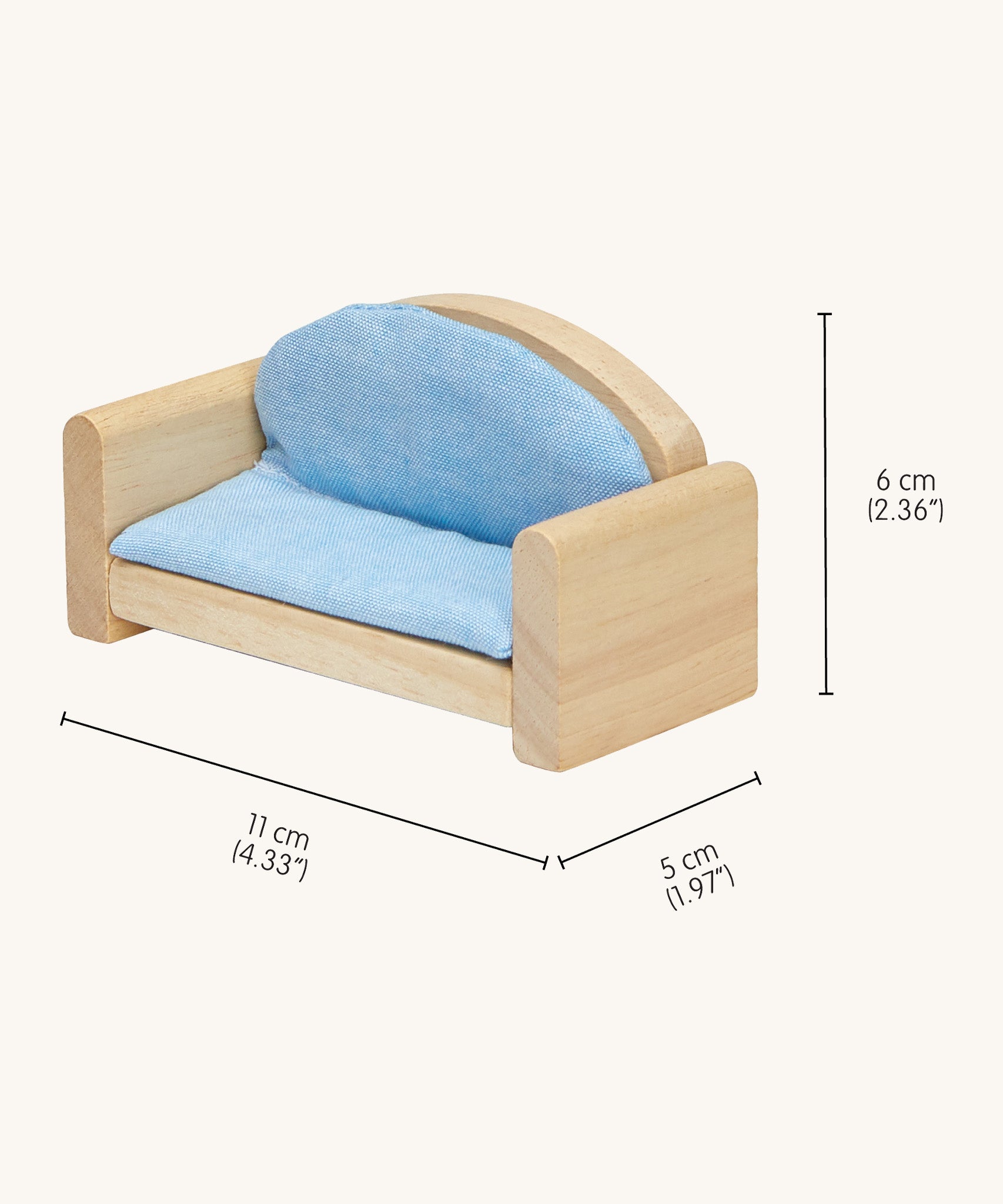 A close up of the sofa from the Plan Toys dolls house furniture set showing the dimensions and light blue cushion
