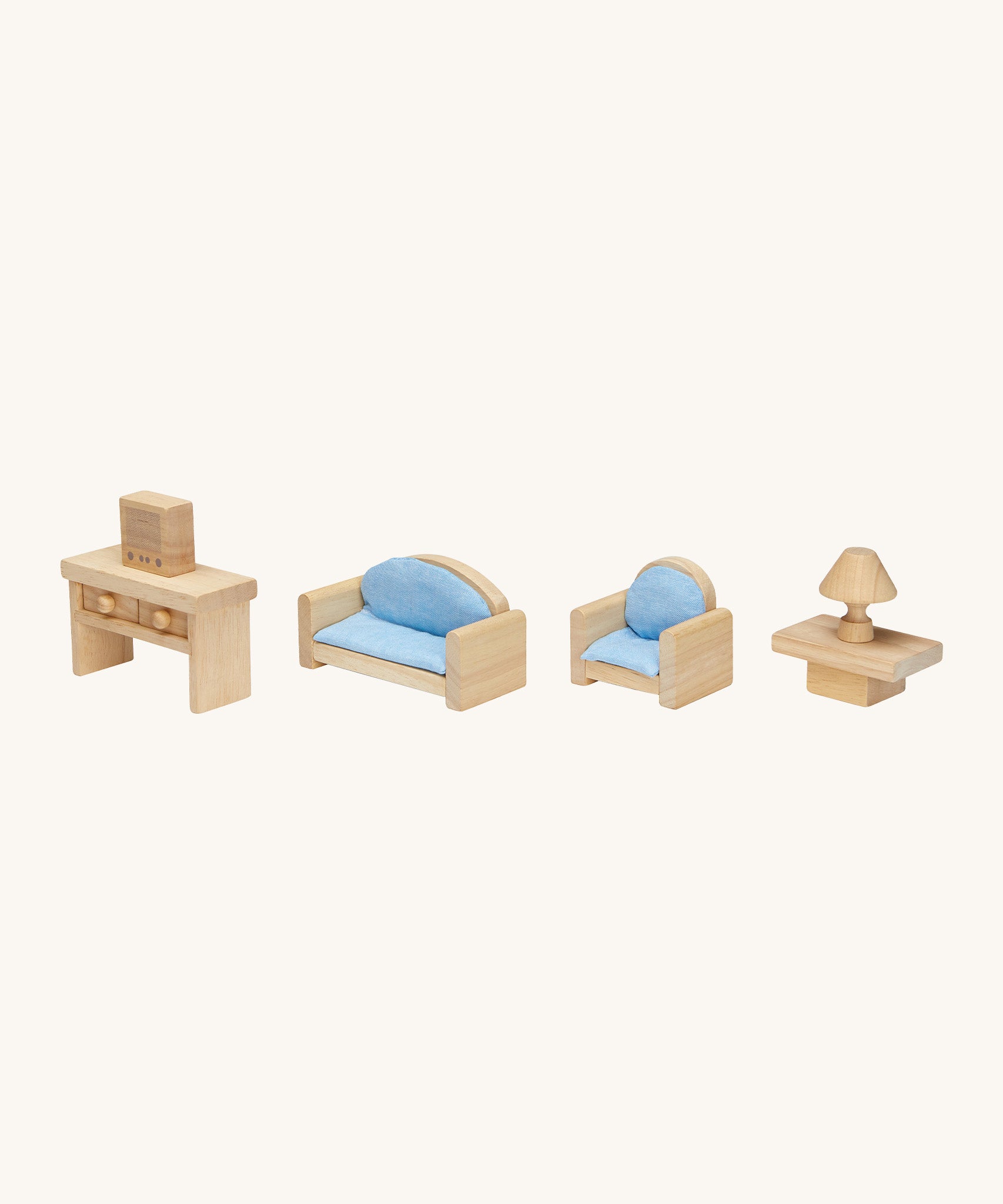 Different Plan Toys doll house furniture pieces lined up. Showing the sofa for two, two armchairs, coffee table, lamp, television and console table. 