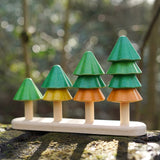 Close up of Plan Toys sustainable Sort and Count Tree toy on a wooden log