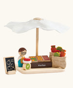 PlanToys Farmer's Market wooden toy playset. Market stall with produce , scales, advert board, mini jute bags and worker.