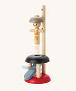 PlanToys Natural Rubberwood Jumping Acrobat Toy. The acrobat figure can be seen blurred in motion as it moves up. PlanToys have a vast range of sustainable wooden toys are available at Babipur.