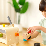 Child playing with the PlanToys little tool bench set.