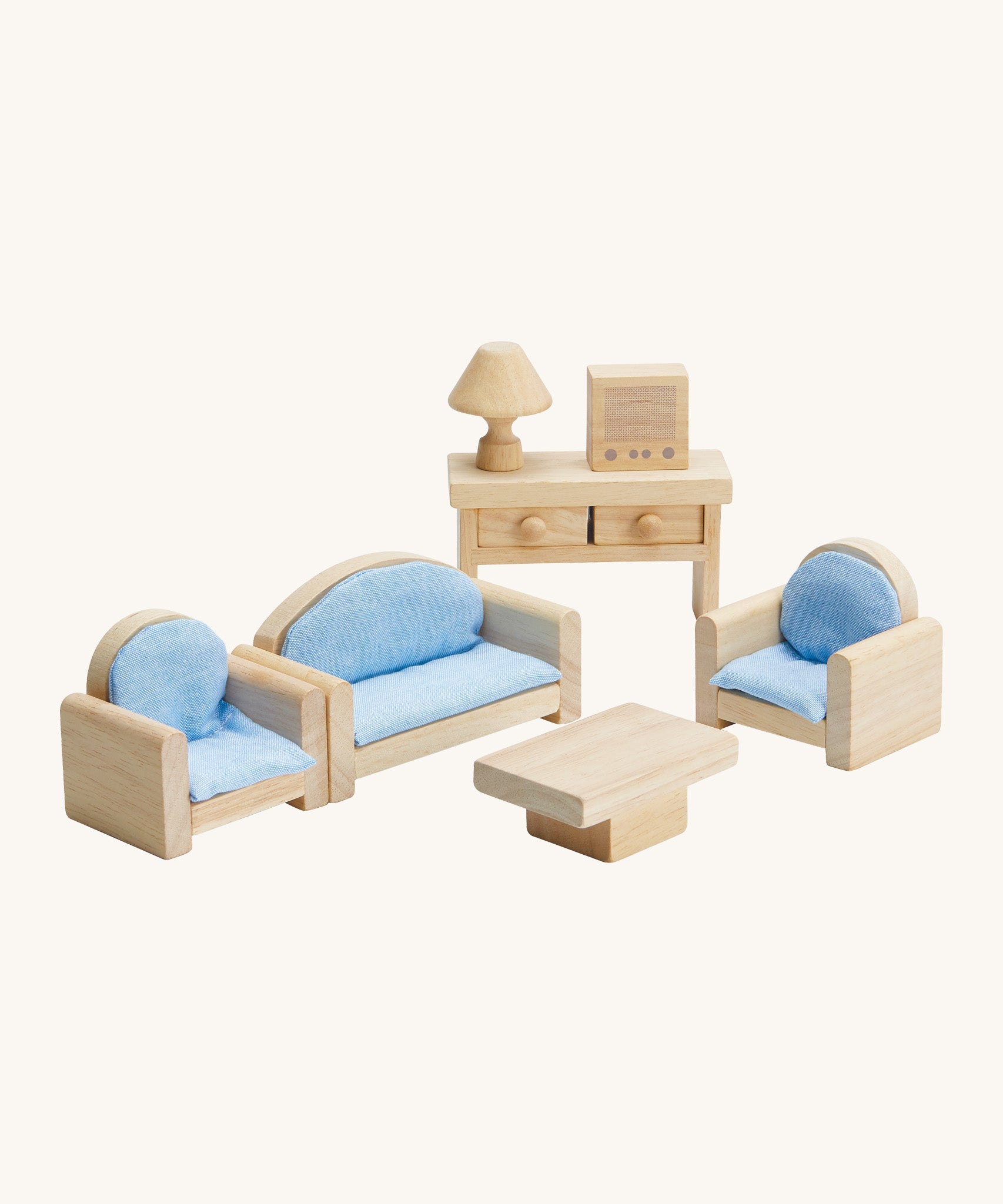 Plan Toys living room furniture set for the doll house. Showing a simple set up of a sofa for two, two armchairs, coffee table, lamp, television and console table. 