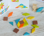 A square shape created using pieces from the PlanToys mini mosaic set, the ideas leaflet can be seen in the background. 