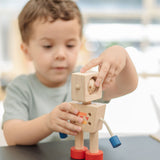 A child turning the head of the  PlanToys Mood Bot Emotions Wooden Toy Robot. PlanToys range of toys are made from sustainably sourced rubberwood, we're proud stockists of PlanToys here at Babipur. 