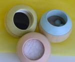 A top view of the Plan Toys Pastel Sensory Tumbling balls showing the different sensory elements. 