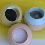A top view of the Plan Toys Pastel Sensory Tumbling balls showing the different sensory elements. 