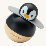 PlanToys Penguin Wobbler wooden baby toy. A circular shaped penguin toy that wobbles when placed on a flat surface. PlanToys range of toys are made from sustainably sourced rubberwood, we're proud stockists of PlanToys here at Babipur. 