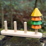 Close up of Plan Toys Sort and Count Tree toy on a wooden log