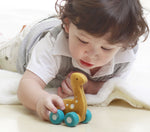 Child playing with the PlanToys Dino Car - Diplo