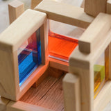 A close up of the Plan Toys Water Blocks showing the coloured liquid inside the block. 
