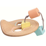 The PlanToys Shape Sorter in pastel shades on a plain background. 