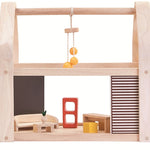 The PlanToys Slide N Go Dolls' House shown extended from the side with furniture inside on a plain background. 