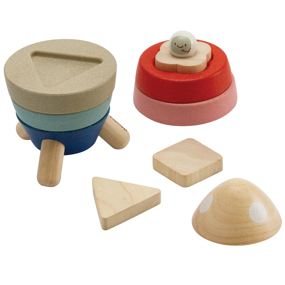 The PlanToys Stacking Rocket Baby Toy shown with some pieces taken off on a plain background. 