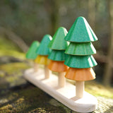 Close up of Plan Toys sustainable Sort and Count Tree toy on a wooden log