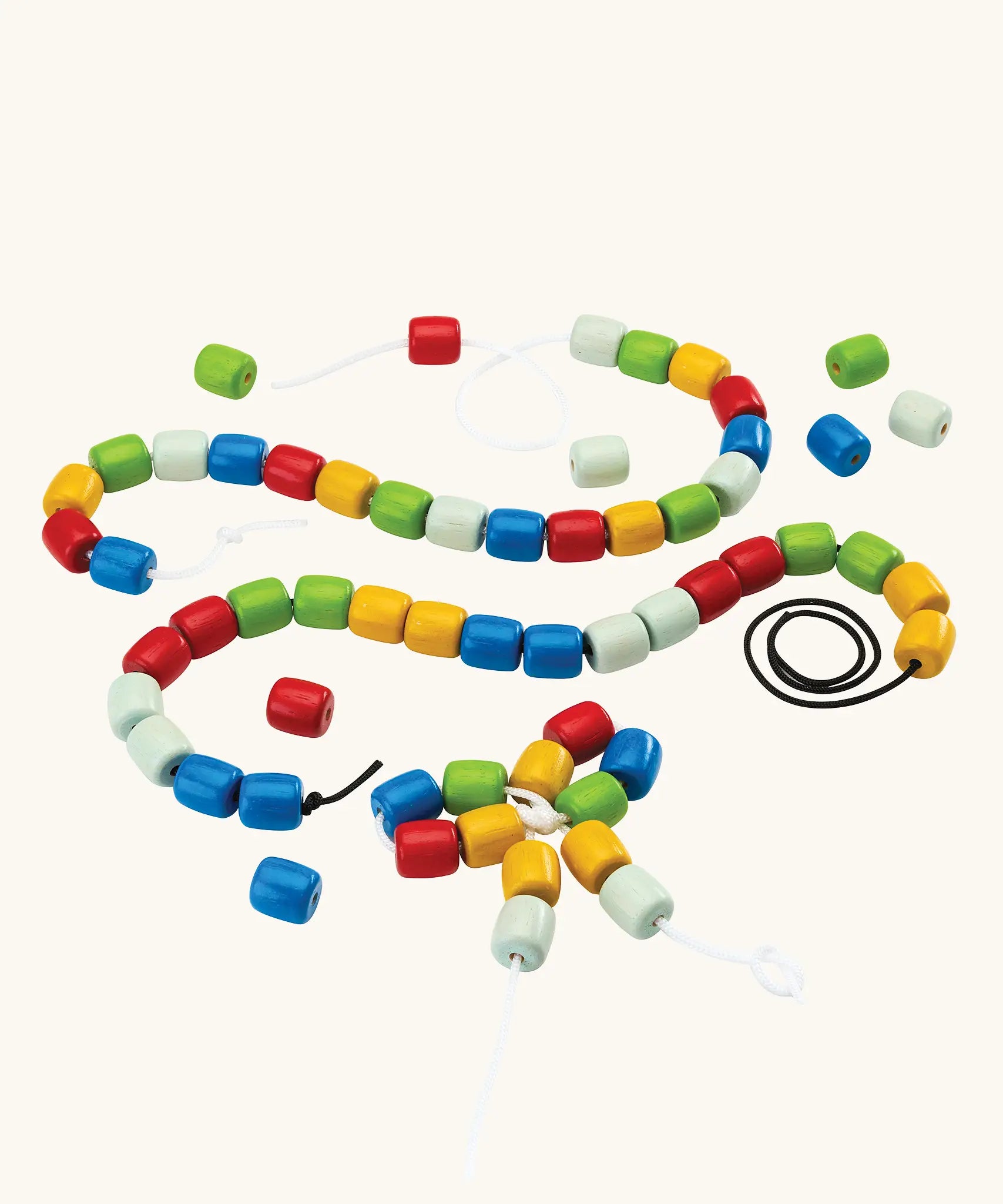 PlanToys threading beads wooden lacing toy. Rainbow coloured wooden beads threaded onto black and white laces.
