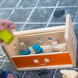 PlanToys wooden robot toolbox play set on the floor with screws inside