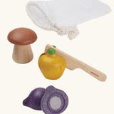 PlanToys wooden veggie play set. Includes loose veg to cut pieces, wooden knife and a net storage bag