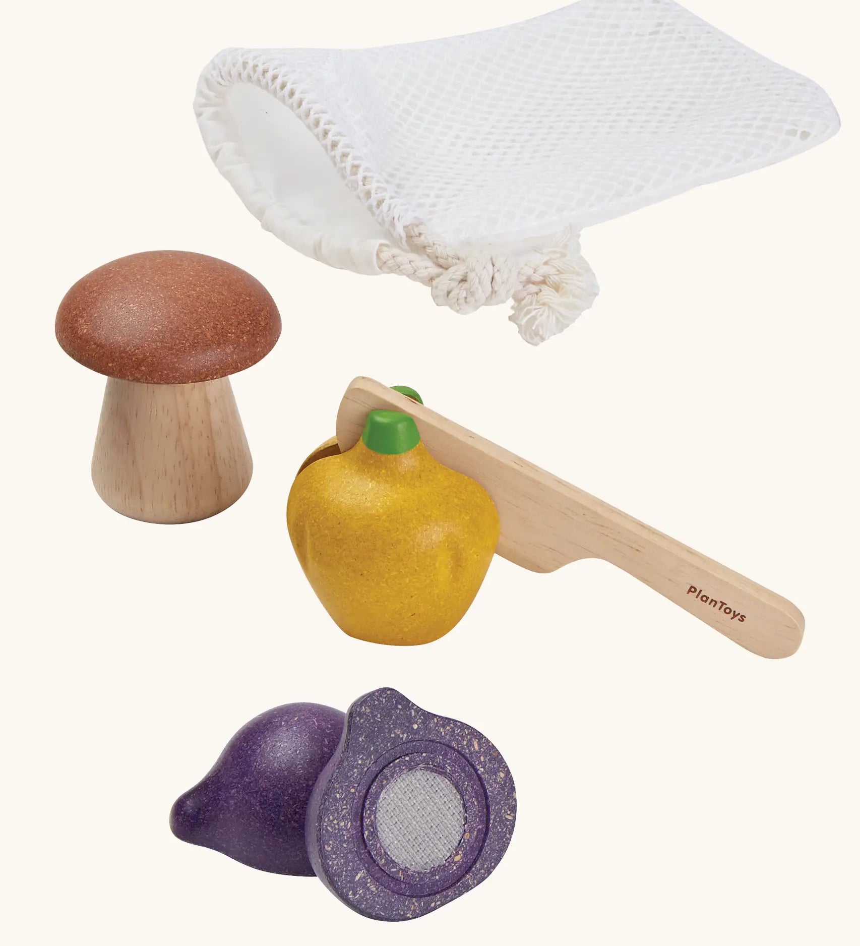 PlanToys wooden veggie play set. Includes loose veg to cut pieces, wooden knife and a net storage bag
