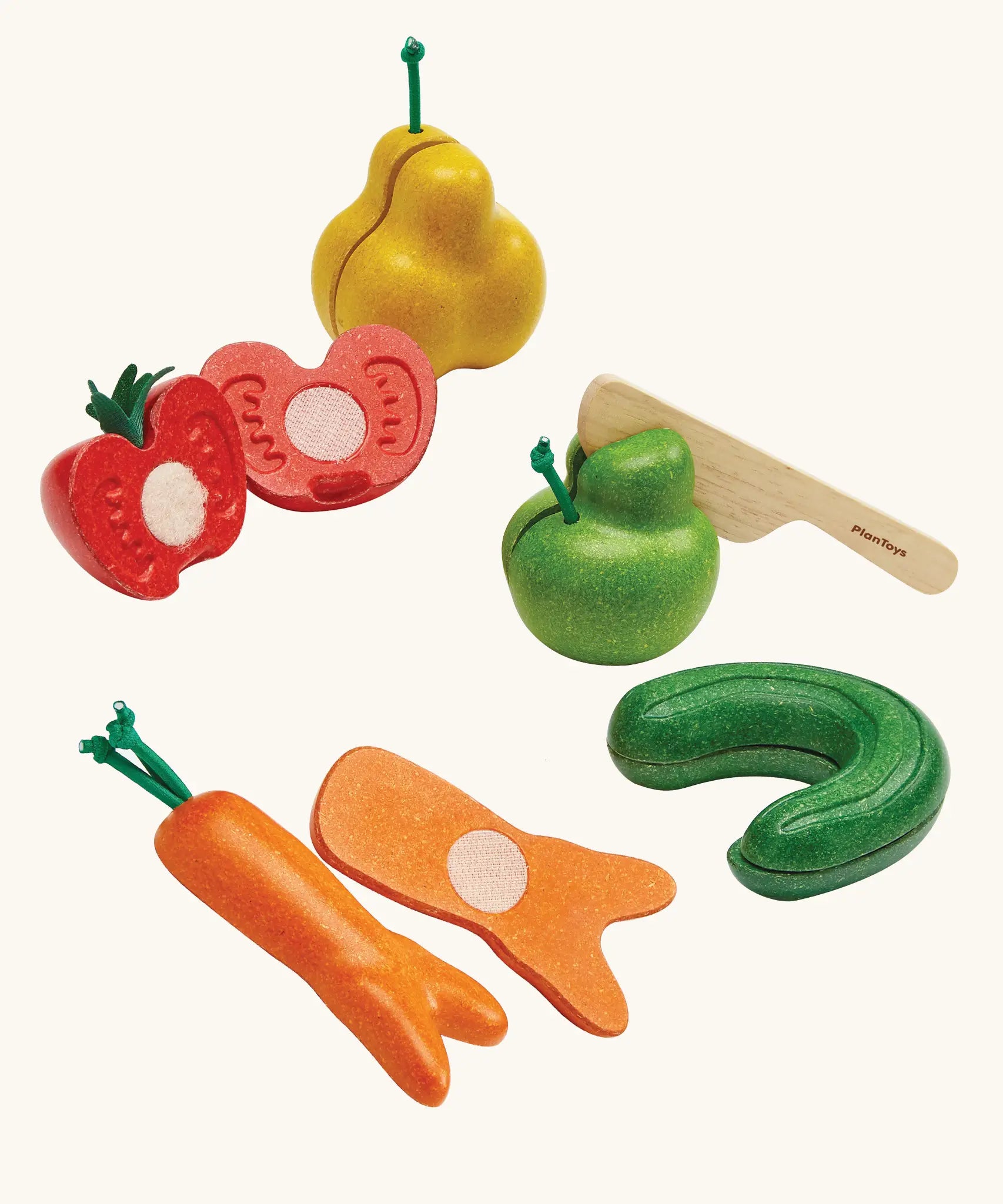 Set of 5 PlanToys wonky fruit and veg pieces with velcro tabs on the inside to pull. Includes a wooden knife