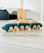 PlanToys blue wooden hybrid train. Three carriage train with magnetic connections. 