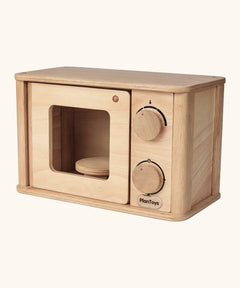 PlanToys wooden microwave play unit. Features working dials and door