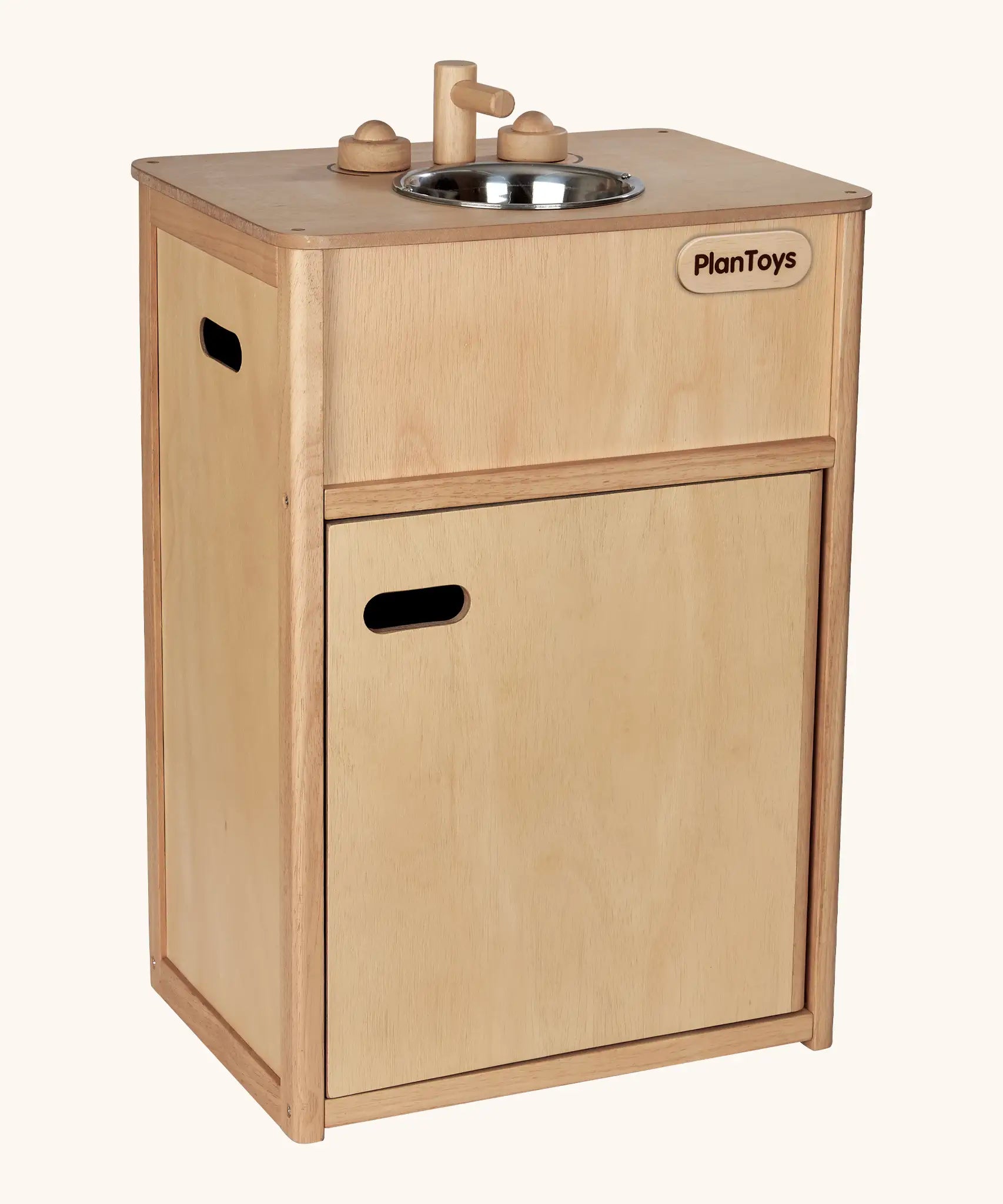 PlanToys wooden play sink. Features a bottom compartment, carry handles, tap knobs and a metal bowl