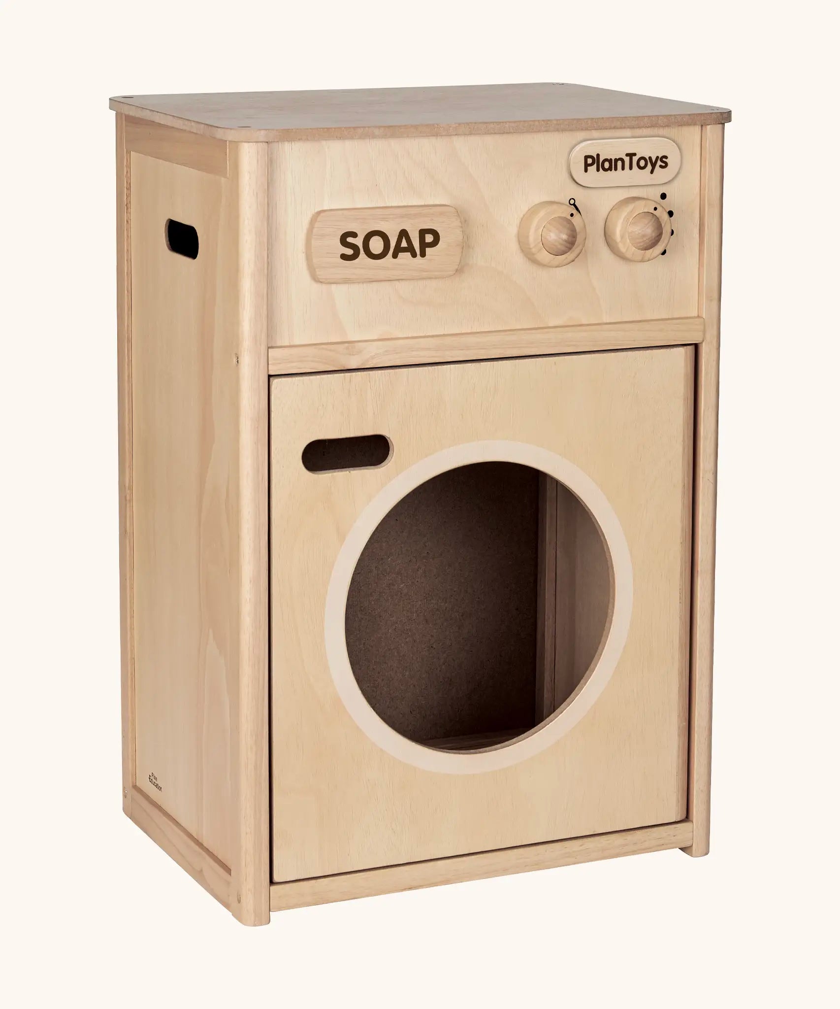 PlanToys wooden washing machine unit. Features working knobs and door 