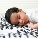 A closer look at the black and white Fern print on the Etta Loves Reversible Organic Cotton Baby Play Mat - Plant Print 