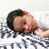 A closer look at the black and white Fern print on the Etta Loves Reversible Organic Cotton Baby Play Mat - Plant Print 