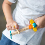  close up of a child playing with the PlanToys Spin N Fly Airplane.