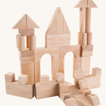 The PlanToys natural wooden 50 Unit Blocks on a plain background. 