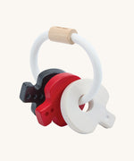 PlanToys wooden baby key rattle toy in a high contrast colourway. This baby toy has three wooden keys in white, red and black strung onto a white rope hoop. PlanToys range of toys are made from sustainably sourced rubberwood, we're proud stockists of PlanToys here at Babipur. 