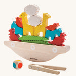 The PlanToys Balancing Boat on a plain background. 
