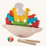 The PlanToys Balancing Boat on a plain background. 