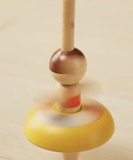 PlanToys wooden ballet spinning top in action