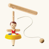 PlanToys wooden ballet spinning top. showing the handle, string to thread and a ballerina spinning top